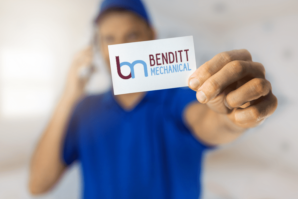 Man holding Benditt Business card